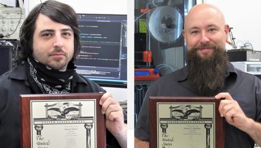 Dan Hatch, Dan Marafino proudly displaying their U.S. Patents