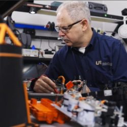 Employee performing service on electronics