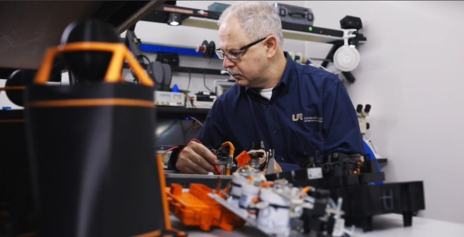 Employee performing service on electronics