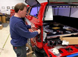 Employee servicing a vehicle